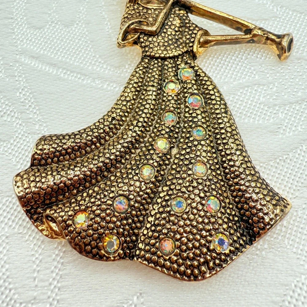Vintage Gold Tone Girl Playing Alphorn Instrument Brooch w/ AB Rhinestones